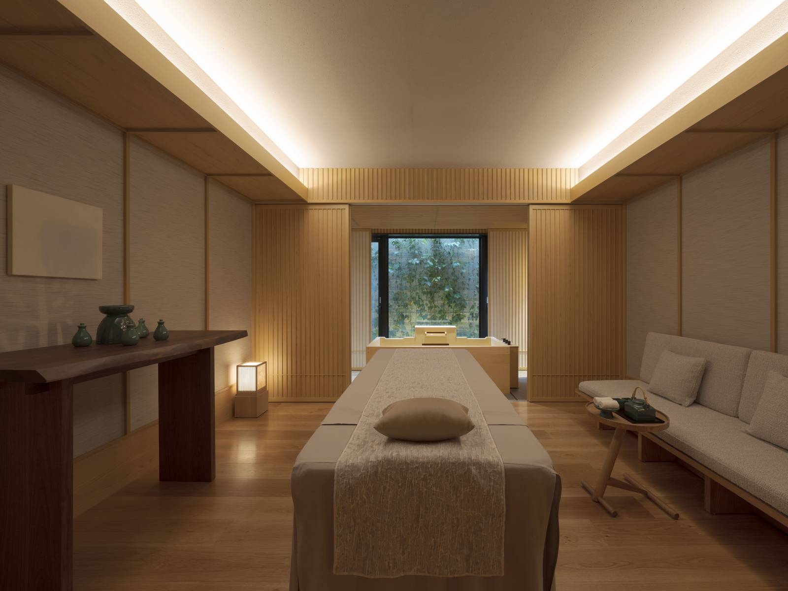 京都東山悅榕庄|Spa 療程室的按摩床與木質牆面