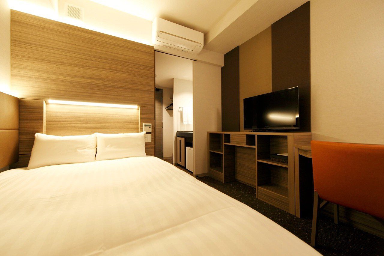 Dormy Inn 鹿兒島 床頭有照明的雙人房